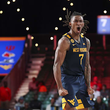 Nov 28, 2024; Paradise Island, Bahamas, BHS;  West Virginia Mountaineers guard Javon Small (7) reacts after scoring during the second half against the Louisville Cardinals at Imperial Arena at the Atlantis resort. 
