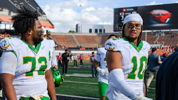 Sep 14, 2024; Corvallis, Oregon, USA; Oregon Ducks offensive lineman Iapani Laloulu (72) and Oregon Ducks defensive end Matayo Uiagalelei (10) leave the field after the game against the Oregon State Beavers at Reser Stadium. 