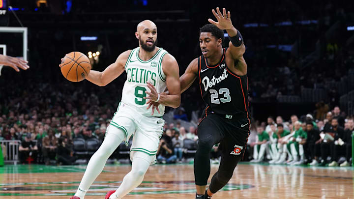 Mar 18, 2024; Boston, Massachusetts, USA; Boston Celtics guard Derrick White (9) returns the ball against Detroit Pistons guard Jaden Ivey (23) in the first quarter at TD Garden. Mandatory Credit: David Butler II-Imagn Images