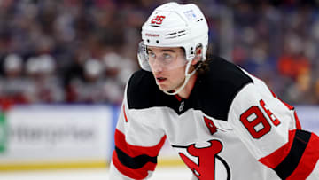 Feb 2, 2025; Buffalo, New York, USA;  New Jersey Devils center Jack Hughes (86) waits for the face-off during the third period against the Buffalo Sabres at KeyBank Center. Mandatory Credit: Timothy T. Ludwig-Imagn Images