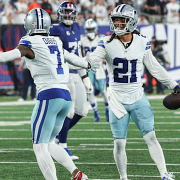 Dallas Cowboys cornerback Stephon Gilmore celebrates his interception with cornerback Trevon Diggs during the first half against the New York Giants at MetLife Stadium. 