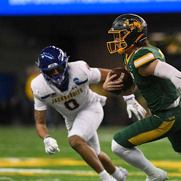 North Dakota State Bison quarterback Cam Miller (7) rushes the ball on Saturday, Dec. 21, 2024, at Fargodome in Fargo, North Dakota.
