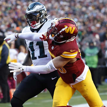 Washington Commanders cornerback Marshon Lattimore defends a pass intended for Philadelphia Eagles wide receiver A.J. Brown.