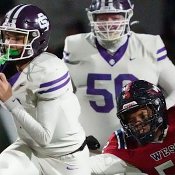 Sevier County's Cooper Newman (7) runs the ball ahead of West's Camarin Leggett (52) during a TSSAA high school football playoff game on Friday, Nov. 22, 2024, in Knoxville, Tenn.