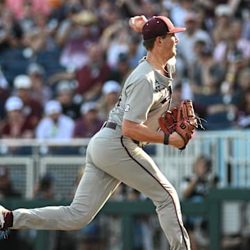 Jun 24, 2024; Omaha, NE, USA;  Texas A&M Aggies starting pitcher Justin Lamkin (33) throws against the Tennessee Volunteers during the first inning at Charles Schwab Field Omaha. Mandatory Credit: Steven Branscombe-Imagn Images