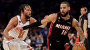 May 2, 2023; New York, New York, USA; Miami Heat forward Caleb Martin (16) controls the ball against New York Knicks guard Jalen Brunson (11) during the first quarter of game two of the 2023 NBA Eastern Conference semifinal playoffs at Madison Square Garden. Mandatory Credit: Brad Penner-USA TODAY Sports