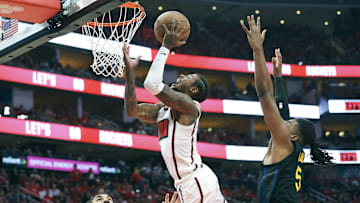 May 4, 2025; Houston, Texas, USA; Golden State Warriors forward Kevon Looney (5) defends as Houston Rockets guard Jalen Green (4) attempts to score during game seven of the first round for the 2025 NBA Playoffs at Toyota Center. Mandatory Credit: Troy Taormina-Imagn Images