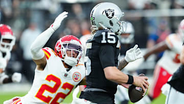 Oct 27, 2024; Paradise, Nevada, USA; Kansas City Chiefs cornerback Trent McDuffie (22) looks to sack Las Vegas Raiders quarterback Gardner Minshew (15) during the second quarter at Allegiant Stadium. Mandatory Credit: Stephen R. Sylvanie-Imagn Images