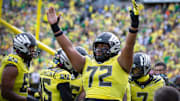 Oregon offensive lineman Iapani Laloulu celebrates a touchdown by Oregon running back Noah Whittington as the No. 1 Oregon Ducks host the No. 21 Illinois Fighting Illini Saturday, Oct. 26, 2024 at Autzen Stadium in Eugene, Ore.