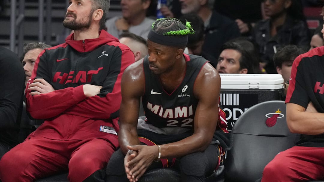 Jan 2, 2025; Miami, Florida, USA;  Miami Heat forward Jimmy Butler (22) looks on from the bench during the second half at Kaseya Center. Mandatory Credit: Jim Rassol-Imagn Images