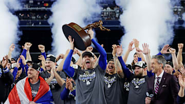 Oct 31, 2024; New York, New York, USA; Los Angeles Dodgers first baseman Freddie Freeman (5) celebrates with the Willie Mays World Series Most Valuable Player Award after being name MVP of the 2024 MLB World Series against the New York Yankees at Yankee Stadium. Mandatory Credit: Brad Penner-Imagn Images