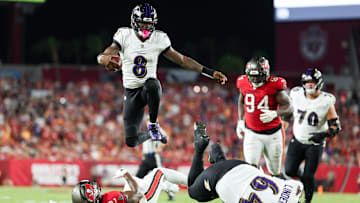 Oct 21, 2024; Tampa, Florida, USA; Baltimore Ravens quarterback Lamar Jackson (8) runs with the ball against the Tampa Bay Buccaneers in the second quarter at Raymond James Stadium. Mandatory Credit: Nathan Ray Seebeck-Imagn Images