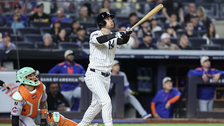 New York Yankees left fielder Cody Bellinger (35) hits a grand slam home run in the eighth inning against the New York Mets at Yankee Stadium. New York Yankees left fielder Cody Bellinger (35) hits a grand slam home run in the eighth inning against the New York Mets at Yankee Stadium.