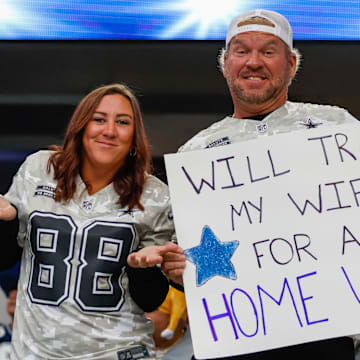 Dallas Cowboys fans hold a sign prior to the game against the New York Giants.