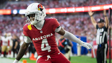 Jan 5, 2025; Glendale, Arizona, USA; Arizona Cardinals wide receiver Greg Dortch (4) celebrates after scoring a touchdown against the San Francisco 49ers in the second half at State Farm Stadium. Mandatory Credit: Mark J. Rebilas-Imagn Images