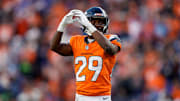 Dec 15, 2024; Denver, Colorado, USA; Denver Broncos cornerback Ja'Quan McMillian (29) gestures in the third quarter against the Indianapolis Colts at Empower Field at Mile High. Mandatory Credit: Isaiah J. Downing-Imagn Images