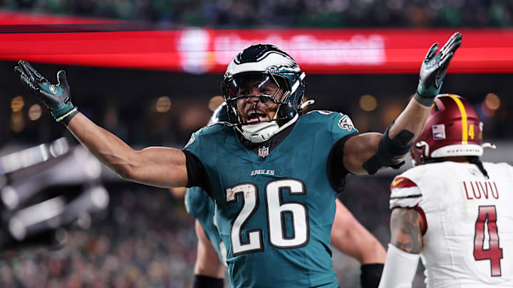 Philadelphia Eagles running back Saquon Barkley (26) celebrates after a touchdown against the Washington Commanders during the second half in the NFC Championship game at Lincoln Financial Field. Philadelphia Eagles running back Saquon Barkley (26) celebrates after a touchdown against the Washington Commanders during the second half in the NFC Championship game at Lincoln Financial Field.