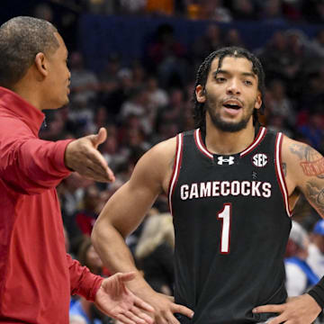 Mar 12, 2025; Nashville, TN, USA;  South Carolina Gamecocks head coach Lamont Paris talks with guard Jacobi Wright (1) during a break in action during the second half at Bridgestone Arena. Mandatory Credit: Steve Roberts-Imagn Images