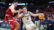 Mar 29, 2024; Dallas, TX, USA; Marquette Golden Eagles guard Tyler Kolek (11) dribble against North Carolina State Wolfpack guard Michael O'Connell (12) during the second half in the semifinals of the South Regional of the 2024 NCAA Tournament at American Airlines Center. Mandatory Credit: Tim Heitman-USA TODAY Sports 