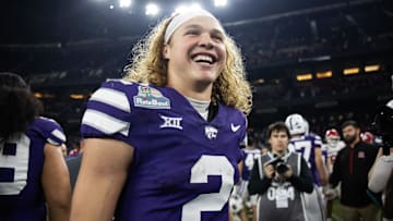 Dec 26, 2024; Phoenix, AZ, USA; Kansas State Wildcats quarterback Avery Johnson (2) celebrates after defeating the Rutgers Scarlet Knights during the Rate Bowl at Chase Field.