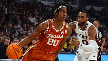 Texas Longhorns guard Tre Johnson (20) drives to the basket as Mississippi State Bulldogs guard Claudell Harris Jr. (0) defends during the first half at Humphrey Coliseum. 