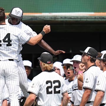 Vanderbilt catcher Colin Barczi (44) celebrates hitting a home run with Vanderbilt utility RJ Austin (42) during a NCAA baseball game between the Tennessee Volunteers and Vanderbilt Commodores at Lindsey Nelson Stadium on May 11, 2025.