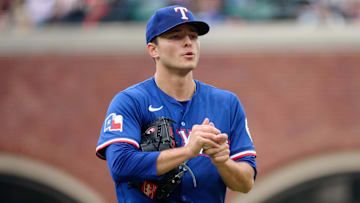 Apr 27, 2025; San Francisco, California, USA; Texas Rangers starting pitcher Jack Leiter (35) rubs up a new baseball against the San Francisco Giants during the third inning at Oracle Park.