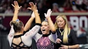 Oklahoma gymnast Jordan Bowers and coach KJ Kindler (right) celebrate 