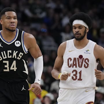 Mar 9, 2025; Milwaukee, Wisconsin, USA;  Milwaukee Bucks forward Giannis Antetokounmpo (34) runs down the court after making a basket against Cleveland Cavaliers center Jarrett Allen (31) in the first half at Fiserv Forum. Mandatory Credit: Michael McLoone-Imagn Images