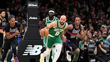 Dec 12, 2024; Boston, Massachusetts, USA; Boston Celtics guard Derrick White (9) dribbles the ball down the court during the second half against the Detroit Pistons at TD Garden. Mandatory Credit: Eric Canha-Imagn Images