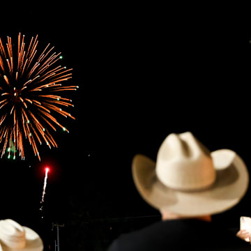 Fans watch the fireworks show
