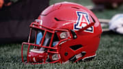 Arizona Wildcats helmet sits on the grass