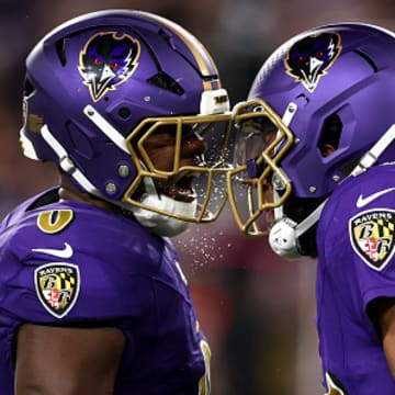Baltimore Ravens linebacker Roquan Smith and cornerback Marlon Humphrey celebrate a play.