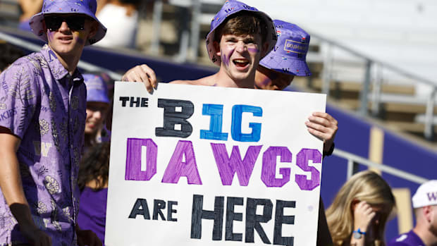 Sep 21, 2024; Seattle, Washington, USA; A Washington Huskiies fan holds a sign before the team’s first Big Ten conference gam