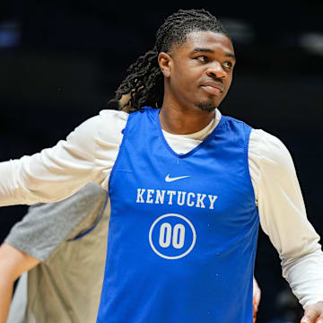 Kentucky Wildcats guard Otega Oweh (00) warms-up Thursday, March 27, 2025, during practice ahead of the Sweet 16 March Madness tournament game against the Tennessee Volunteers at Lucas Oil Stadium in Indianapolis.
