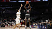 Mar 15, 2025; Washington, D.C., USA; Saint Joseph's Hawks forward Rasheer Fleming (13) shoots the ball over Saint Joseph's Hawks forward Shawn Simmons II (10) in the first half at Capital One Arena. Mandatory Credit: Geoff Burke-Imagn Images