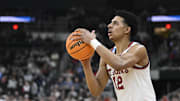 Mar 20, 2025; Providence, RI, USA;  St. John's Red Storm guard RJ Luis Jr. (12) puts up a shot during the second half against the Omaha Mavericks at Amica Mutual Pavilion. Mandatory Credit: Eric Canha-Imagn Images