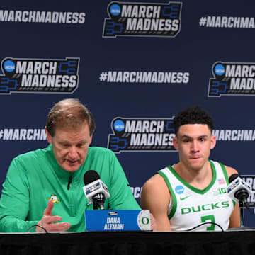 Mar 21, 2025; Seattle, WA, USA; Oregon Ducks head coach Dana Altman speaks at a press conference with guard Jackson Shelstad (3) and center Nate Bittle (32) after defeating the Liberty Flames in the first round of the NCAA Tournament at Climate Pledge Arena. Mandatory Credit: Steven Bisig-Imagn Images