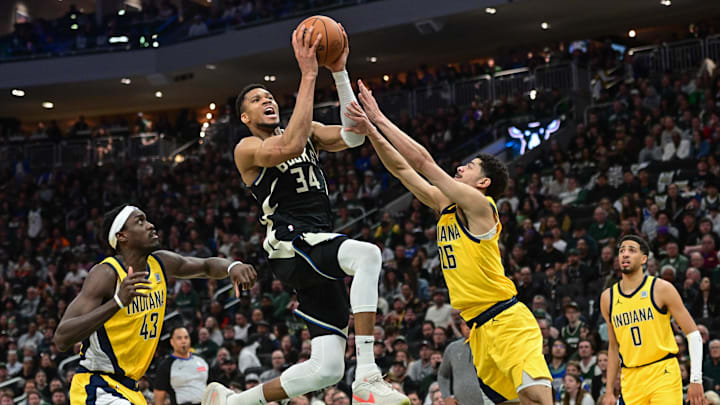 Apr 27, 2025; Milwaukee, Wisconsin, USA; Milwaukee Bucks forward Giannis Antetokounmpo (34) takes a shot between Indiana Pacers forward Pascal Siakam (43) and guard Ben Sheppard (26) in the third quarter during game four of first round for the 2024 NBA Playoffs at Fiserv Forum. Mandatory Credit: Benny Sieu-Imagn Images Apr 27, 2025; Milwaukee, Wisconsin, USA; Milwaukee Bucks forward Giannis Antetokounmpo (34) takes a shot between Indiana Pacers forward Pascal Siakam (43) and guard Ben Sheppard (26) in the third quarter during game four of first round for the 2024 NBA Playoffs at Fiserv Forum. Mandatory Credit: Benny Sieu-Imagn Images