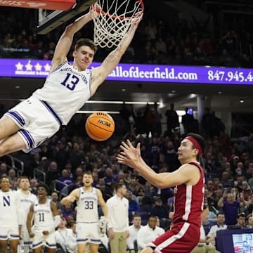 Feb 7, 2024; Evanston, Illinois, USA; Northwestern Wildcats guard Brooks Barnhizer (13) dunks the ball on Nebraska Cornhuskers guard Keisei Tominaga (30) during the second half at Welsh-Ryan Arena. Mandatory Credit: David Banks-Imagn Images