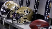 Nov 5, 2023; New Orleans, Louisiana, USA;  Detailed view of the New Orleans Saints helmets on the team bench against the Chicago Bears during the first half at the Caesars Superdome. Mandatory Credit: Stephen Lew-Imagn Images