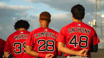 Boston's top-three prospects in Marcelo Mayer, Kristian Campbell and Roman Anthony stand for the national anthem ahead of a Spring Training breakout game on March 13, 2025.