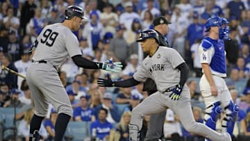 Oct 26, 2024; Los Angeles, California, USA; New York Yankees outfielder Juan Soto (22) celebrates with outfielder Aaron Judge (99) after hitting a solo home run in the third inning against the Los Angeles Dodgers during game two of the 2024 MLB World Series at Dodger Stadium. Mandatory Credit: Jayne Kamin-Oncea-Imagn Images
