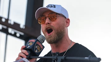 Jun 22, 2025; Fort Lauderdale, Florida, UNITED STATES; Florida Panthers center Sam Bennett (9) speaks to the fans during the Stanley Cup championship parade and rally. Mandatory Credit: Sam Navarro-Imagn Images
