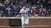 Apr 21, 2025; New York City, New York, USA; New York Mets first baseman Pete Alonso (20) hits a single against the Philadelphia Phillies during the sixth inning at Citi Field. Mandatory Credit: John Jones-Imagn Images
