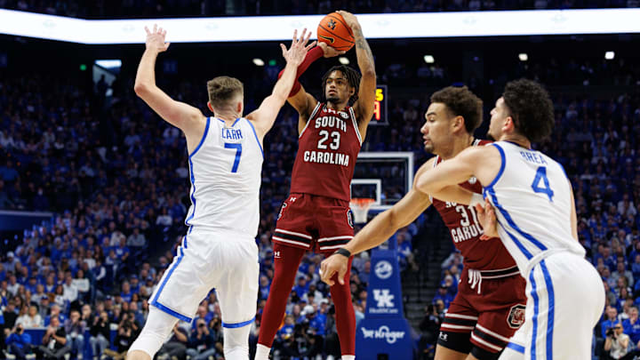 Feb 8, 2025; Lexington, Kentucky, USA; South Carolina Gamecocks guard Cam Scott (23) shoots the ball against Kentucky Wildcats forward Andrew Carr (7) during the first half at Rupp Arena at Central Bank Center. Mandatory Credit: Jordan Prather-Imagn Images Feb 8, 2025; Lexington, Kentucky, USA; South Carolina Gamecocks guard Cam Scott (23) shoots the ball against Kentucky Wildcats forward Andrew Carr (7) during the first half at Rupp Arena at Central Bank Center. Mandatory Credit: Jordan Prather-Imagn Images