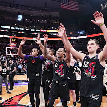 Apr 9, 2025; Toronto, Ontario, CAN; Toronto Raptors forward Scottie Barnes (4) and guard A.J. Lawson (0) acknowledge the crowd after a game against the Charlotte Hornets at Scotiabank Arena. Mandatory Credit: Nick Turchiaro-Imagn Images