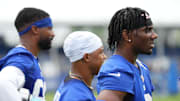 Jul 25, 2024; East Rutherford, NY, USA; New York Giants wide receiver Malik Nabers (right) watches a drill with wide receiver Wan'Dale Robinson (middle) and wide receiver Darius Slayton (left) during training camp at Quest Diagnostics Training Center.  