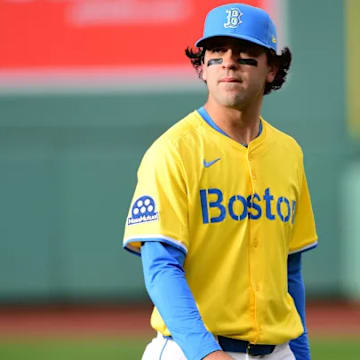Marcelo Mayer walks to third base at Fenway Park during his MLB debut. 