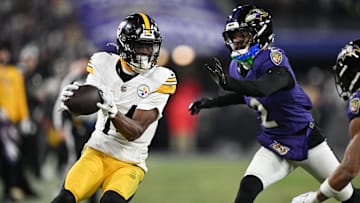 Pittsburgh Steelers wide receiver George Pickens makes a catch against Baltimore Ravens cornerback Nate Wiggins